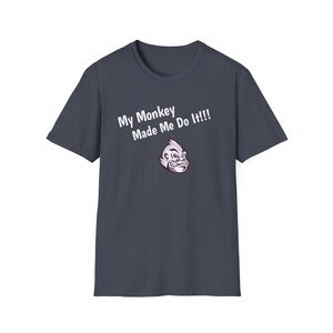 May include: A dark blue t-shirt with white text that reads "My Monkey Made Me Do It!!" and a cartoon image of a monkey's face.
