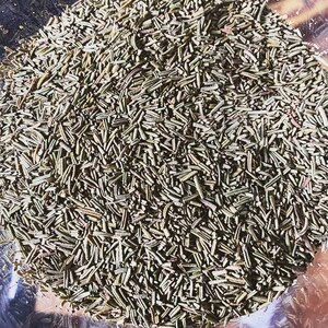 May include: A close-up view of a bowl filled with dried rosemary needles. The needles are a light green color and are arranged in a random pattern.