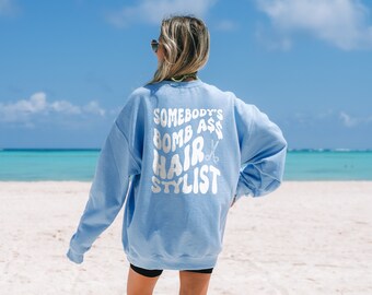 Somebody's Bomb Ass Hair Stylist Sweatshirt -  Hairdresser Gift Stay Stylish and Comfortable with Our Bomb Ass Hairstylist Sweater for Women