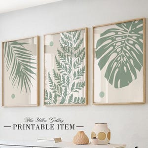 Sage green botanical palm leaves art set of 3. Modern bohemian minimalist greenery gallery wall set. Simple nature above bed decor prints