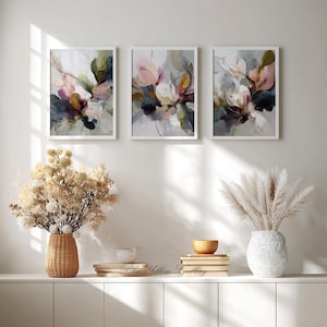 Neutral floral wall art set framed in light wood frames