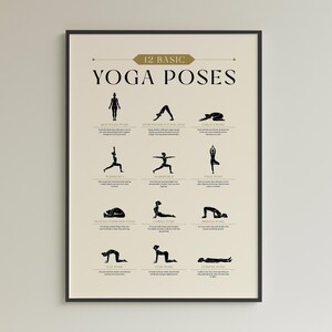 May include: A framed poster featuring 12 basic yoga poses in black silhouettes against a beige background. The title "12 BASIC YOGA POSES" is displayed in a decorative font. Each pose is labeled with its name and a brief description.