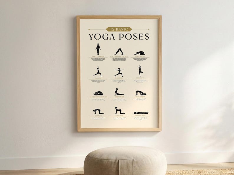 May include: A framed poster with the text "12 Basic Yoga Poses" in a beige and gold color scheme. The poster displays black silhouette illustrations of various yoga poses. The frame is a light wood color.