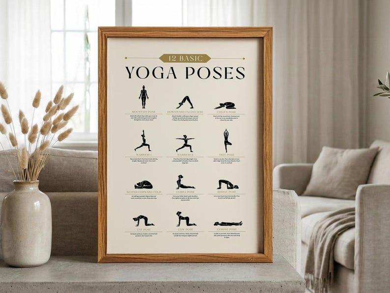 May include: A framed print featuring 12 basic yoga poses in black silhouettes on a cream background. The print is in a light brown wooden frame and includes the text "12 Basic Yoga Poses" at the top.