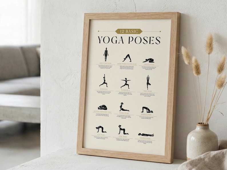May include: A framed print displaying 12 basic yoga poses in black against a cream background. The text "12 Basic Yoga Poses" is at the top. The frame is light brown, and the print is displayed on a white surface.