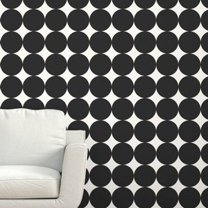 May include: Black and white polka dot wallpaper pattern. The wallpaper features large black circles on a white background.