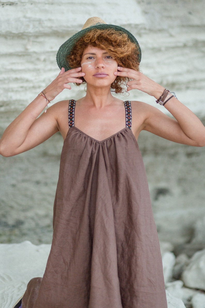 This stunning Irazu dress is hand made in Bulgaria from 100% natural linen fabric. 
It features a unique design with a shorter length in the front and longer length in the back. This dress is available in many beautiful colours.