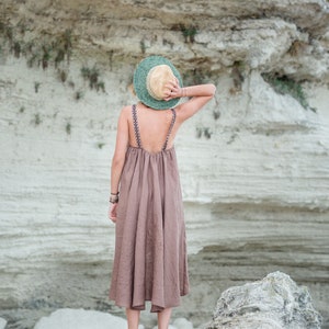 This stunning Irazu dress is hand made in Bulgaria from 100% natural linen fabric. 
It features a unique design with a shorter length in the front and longer length in the back. This dress is available in many beautiful colours.