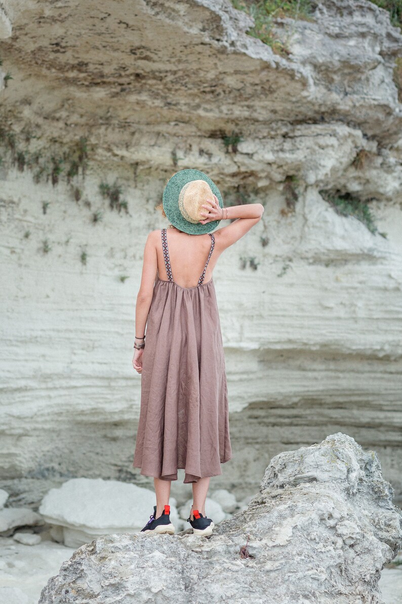 This stunning Irazu dress is hand made in Bulgaria from 100% natural linen fabric. 
It features a unique design with a shorter length in the front and longer length in the back. This dress is available in many beautiful colours.