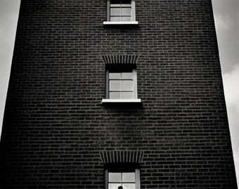 Urban Dreamscape: Brick Building Facade with a Silhouette | Canvas Print | Photography Wall Art | Custom Canvas Curators