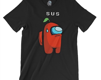 May include: Black t-shirt with a red Among Us character with a green leaf on its head. The text "SUS" is above the character.