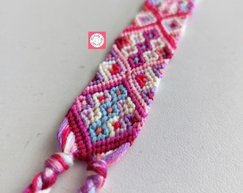 Handmade, pink toned, wide friendship bracelet