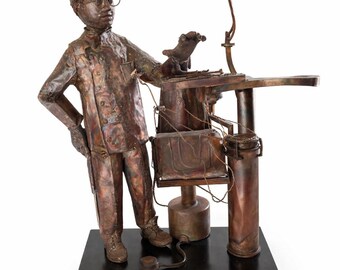 Escultura de dentista en bronce y cobre de H. Mitchell Allen