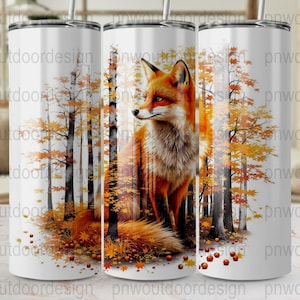 Puede incluir: Un vaso blanco con una ilustración de un zorro rojo en un bosque otoñal. El diseño presenta árboles con hojas naranjas y amarillas, creando un ambiente de temporada. El vaso tiene una pajita y un borde plateado.