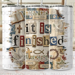 May include: A white tumbler with a collage design featuring religious symbols, text, and the phrase "it is finished." The design includes a cross, dove, and the text "John 19:30."
