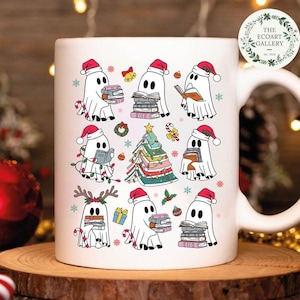 May include: White ceramic mug with a Christmas-themed design featuring ghosts wearing Santa hats and holding stacks of books. The ghosts are surrounded by Christmas decorations like snowflakes, candy canes, and a Christmas tree made of books. The mug also features the text "The Ecoart Gallery Est. 2023".