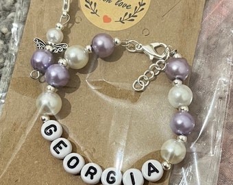 Personalised Children’s bracelet. Custom made with any name or relationship. Free gift wrap and angel charm.