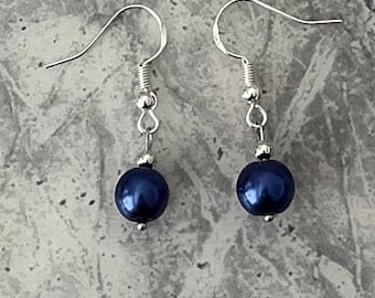 Navy pearl single drop earrings. Sterling silver ear hook with a simple but classy single pearl drop.