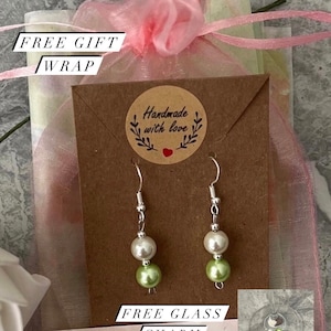 Green pearl earrings. Sterling silver earhook with a green and cream dangle drop.