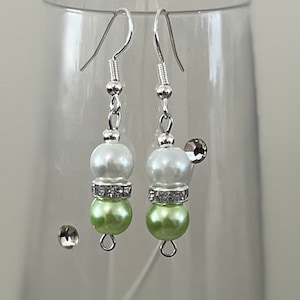 Green pearl earrings. Sterling silver earhook with a green and cream dangle drop.