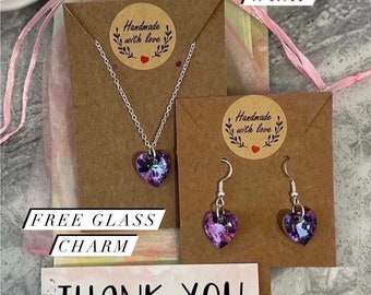 Purple heart necklace and earrings set. Silver necklace with purple glass crystal heart pendant and matching earrings.