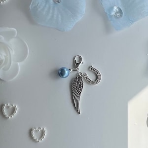 Something blue horse shoe and angel wing charm. Perfect charm gifts for a brides bouquet or to attach where she pleases.