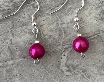 Hot pink pearl earrings. Sterling silver ear hook with a simple but classy pearl drop.