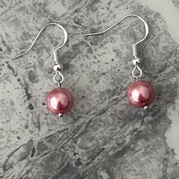 Pink pearl earrings. Sterling silver ear hook with a single blush pearl drop. Simple but classy.
