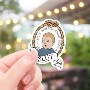 May include: A white sticker featuring a cartoon character with the text "I'M A LITTLE WORRIED ABOUT BEING A SLUT" in a rope-like border. The character is a young boy with blonde hair and a blue shirt.