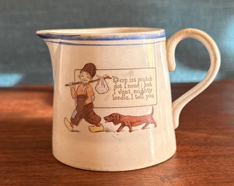 Antique Porcelain Pitcher Featuring A Runaway Boy Carrying a Bindle and His Dachshund, Made by the Harker Pottery Company
