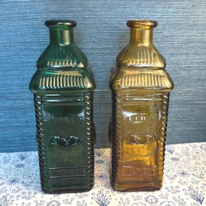 Vintage Pair of Amber and Green Berring&#39;s Apple Bitters Bottles