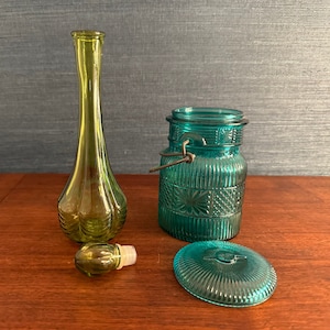 Pair of Colorful Avon Bottles (Empty): One Green Glass Perfume Bottle and One Turkoise Glass Soap Canister