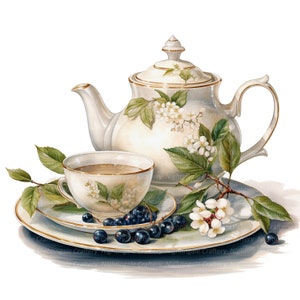 Peut inclure: Une th&eacute;i&egrave;re blanche avec un motif floral et une tasse et une soucoupe assorties. La th&eacute;i&egrave;re a une bordure dor&eacute;e et la tasse et la soucoupe ont un bord dor&eacute;. Il y a des baies noires et des fleurs blanches sur la table.