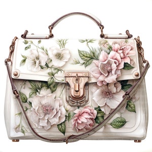 May include: A white leather handbag with a floral design. The bag has a gold clasp and a brown leather strap. The flowers are pink and white.