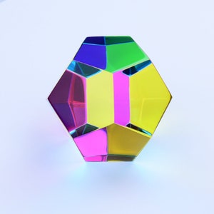 May include: A multi-faceted, iridescent geometric object with a yellow, green, blue, pink, and purple color scheme. The object is made of glass and has a reflective surface.