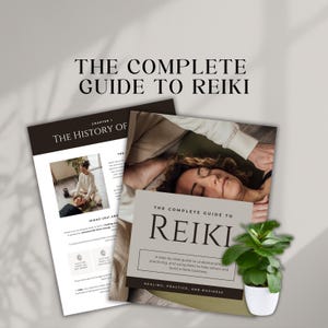 May include: Two books titled "The Complete Guide to Reiki" and "The History Of" are displayed. The cover of the first book features the title in large, elegant font. The second book has a photo of a person receiving Reiki. A small potted plant is in the foreground.