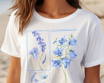 May include: White t-shirt with a blue floral print featuring four different types of flowers. The flowers are outlined in blue and are arranged in a grid pattern.