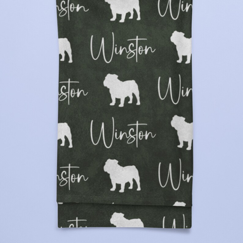 Dark green English Bulldog blanket with white english bulldog silhouettes and custom name, personalized dog lover throw blanket in premium fleece.