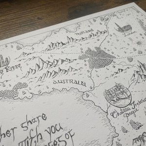 May include: A black and white hand-drawn map with the words "Hong Kong", "Australia", "Thailand", "London", and "Chateau Trebice Prague" written on it.