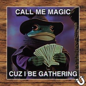 May include: A humorous square magnet featuring a frog dressed as a wizard, holding a stack of money. The text reads "CALL ME MAGIC CUZ I BE GATHERING" in white letters against a purple background.