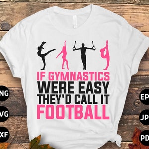May include: White t-shirt with a pink and black graphic that says "If gymnastics were easy they'd call it football".