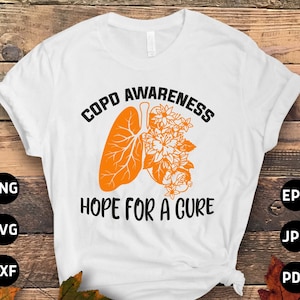 Puede incluir: Camiseta blanca con texto naranja que dice "COPD AWARENESS HOPE FOR A CURE". El texto está rodeado por un contorno naranja de un pulmón con flores.