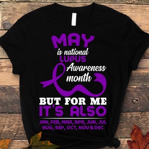 May include: Black t-shirt with purple text and a purple ribbon design. The text reads "May is national Lupus Awareness month but for me it's also Jan, Feb, Mar, Apr, Jun, Jul Aug, Sep, Oct, Nov & Dec".