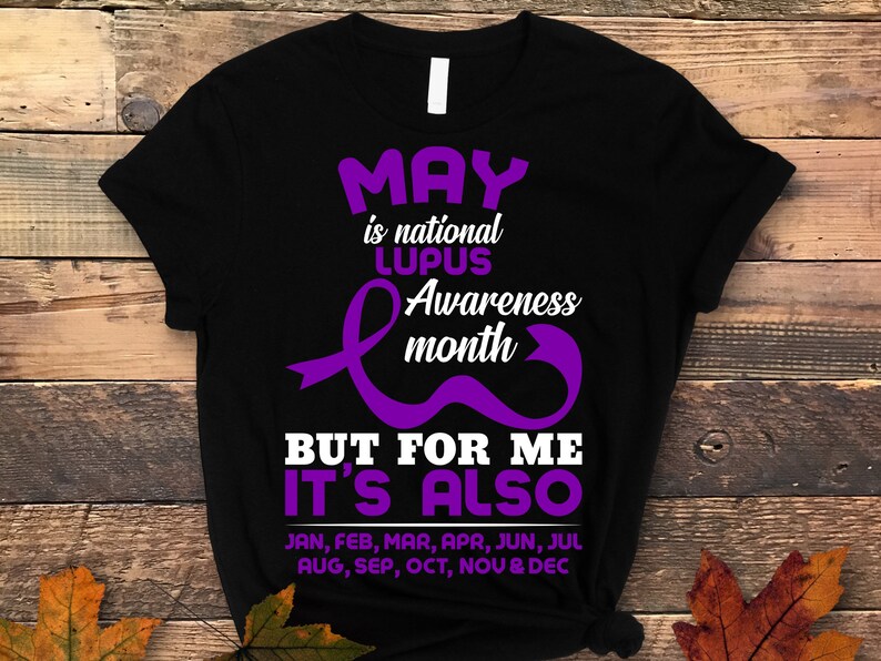 May include: Black t-shirt with purple text and a purple ribbon design. The text reads "May is national Lupus Awareness month but for me it's also Jan, Feb, Mar, Apr, Jun, Jul Aug, Sep, Oct, Nov & Dec".