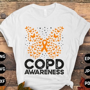 May include: White t-shirt with an orange ribbon and butterfly design. The text "COPD AWARENESS" is printed in black with a distressed effect.