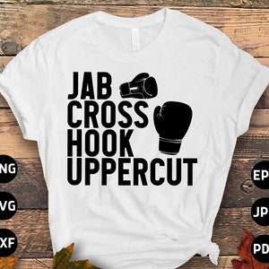 May include: White t-shirt with black text that reads "Jab Cross Hook Uppercut" and two black boxing gloves.