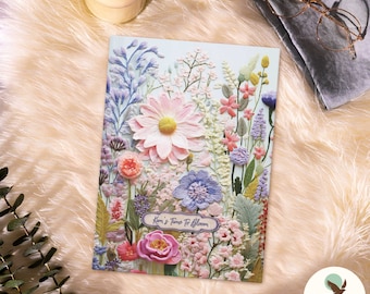 May include: A colorful floral embroidery design with pink, purple, and green flowers. The design includes the text "It's Time To Bloom".