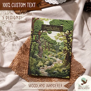 1 of 5 Forest aesthetic journal gifts for hikers, her or him. This woodland notebooks is called Woodland Wanderer and is displayed on a beige outdoor picnic blanket. A rustic forest green nature journal for family memories, hiking adventures and forest lovers.