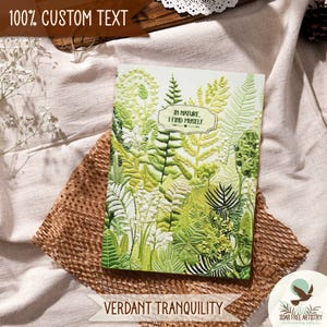 4 of 5 Forest fern journal gifts, personalized notebooks, with my visually textured artwork on the cover. Introducing, Verdant Tranquility, a light green ferns journal with a white background, which is displayed on a beige outdoor picnic blanket.
