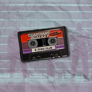 May include: Black and red cassette tape pin with the text "Guardians of the Galaxy Cosmic Reunion 6 Song Club".